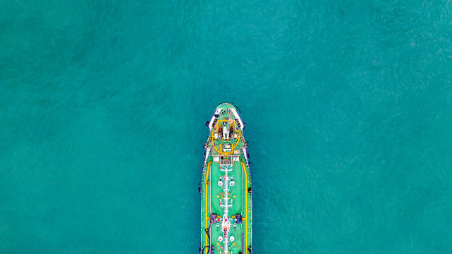 Tanker ship carrying oil and gas in the sea support freight transportation import export business logistic, Aerial view tanker ship.