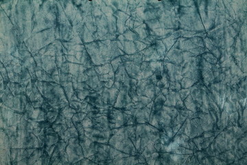 Close up of blue textured surface with crinkles.