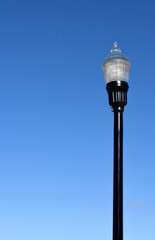 Fototapeta na wymiar Vintage Lamp Street Light in Blue Sky Background gas Electric Power