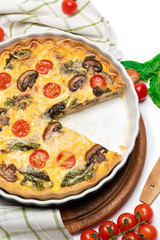 Baked homemade quiche pie in ceramic baking form