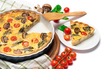 Baked homemade quiche pie in ceramic baking form