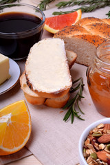 Slice of white bread with butter and a cup of black coffee. Food for breakfast