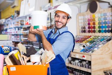 Master selecting paint in store