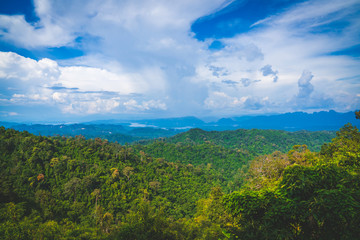 Obraz premium Blue sky high peak mountains fog hills mist scenery national park views at Phu Tub Berk, Khao Koh, Phetchabun Province, Thailand