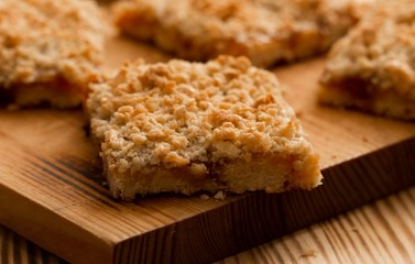 homemade apple pie on wooden background close up with copy space