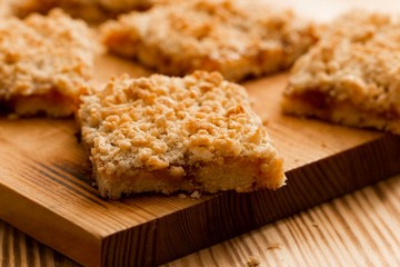 homemade apple pie on wooden background close up with copy space