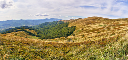 Naklejka premium Beautiful panoramic view of the Bieszczady mountains in the early autumn, Bieszczady National Park (Polish: Bieszczadzki Park Narodowy), Poland.