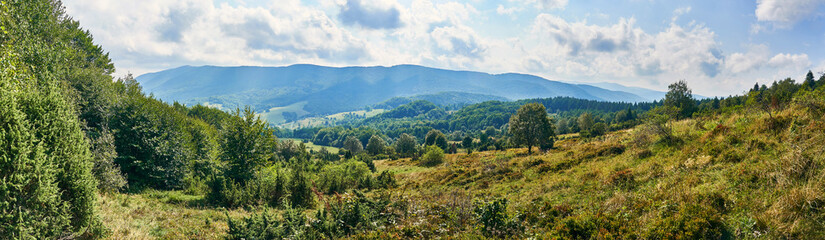 Fototapeta na wymiar Beautiful panoramic view of the Bieszczady mountains in the early autumn, Bieszczady National Park (Polish: Bieszczadzki Park Narodowy), Poland.