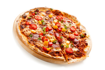 Pizza with ham and vegetables on white background