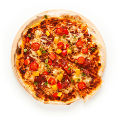 Pizza with ham and vegetables on white background
