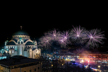 Fototapeta na wymiar Belgrade, Serbia - January 14, 2019: Orthodox New years eve celebration with fireworks over the Church of Saint Sava at midnight in Belgrade, Serbia