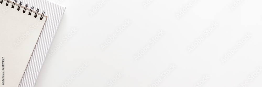 Wall mural white office desk with empty space for text. copy space. office accessories such notebook and paper.
