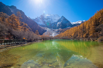 Naklejka na ściany i meble pearl lake with snow mountain in yading nature reserve, Sichuan, China.