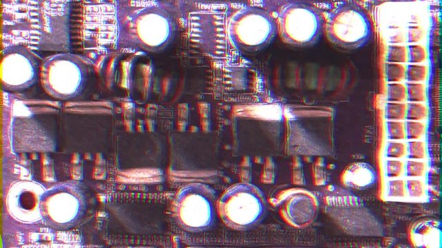 Intentional noise distortion fx tv transmission: the components on a computer board, full of dust. Shot from above.
