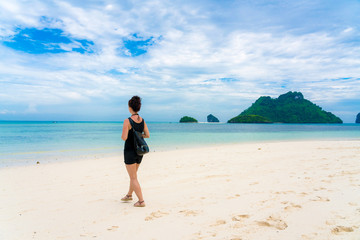 Fototapeta na wymiar Woman on Beautiful Tropical Beach PP Island, Krabi, Phuket, Thailand blue ocean background girl items vacation accessories for holiday or long weekend a guide choice idea for planning travel