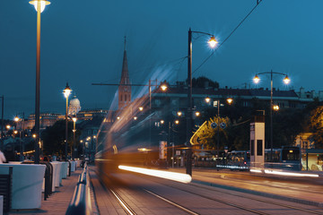 Naklejka na ściany i meble Motion blur of night city traffic / light trails motion background in Budapest