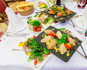 Various cold appetizers on the buffet: seafood, vegetables, meat, delicacies.