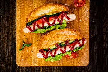 Hot dogs and french fries on cutting board