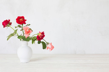  flowers in vase on white background