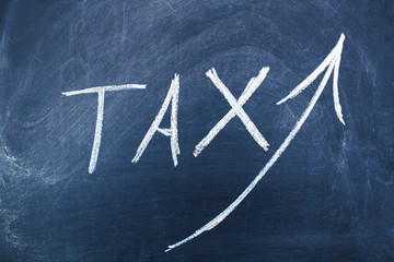 tax text on chalkboard