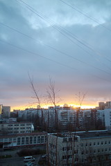 Naklejka premium dawn over the city block in autumn