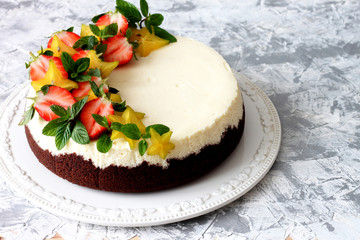 Homemade cheesecake with fresh strawberries and carambola 