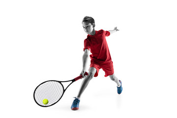 Young teen boy tennis player in motion or movement isolated on white studio background. The sport,...