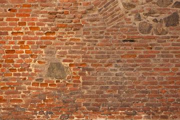 old red brick wall with stone