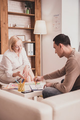 Obraz premium Positive delighted blonde female person working in clinic