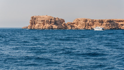 Fototapeta na wymiar Sinai mountains and picturesque landscapes of the red sea in Egypt. Boat trip on the red sea