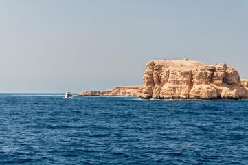 Fototapeta na wymiar Sinai mountains and picturesque landscapes of the red sea in Egypt. Boat trip on the red sea