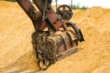  huge excavator bucket digs sand in  sand quarry mining © Оксана Скиданова
