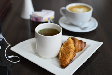 breakfast with coffee and croissant