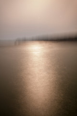 Abstract long exposure image of sunset and the sea blurry context