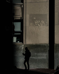 Fototapeta na wymiar Silhouette of a person on the street