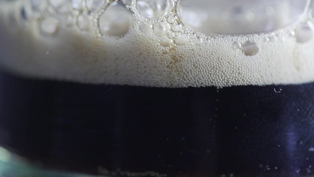 Slow Mo shot of beer bubbles. Glamour shots of beer being poured