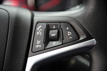 Obraz na płótnie Canvas controls near the steering wheel in a modern car