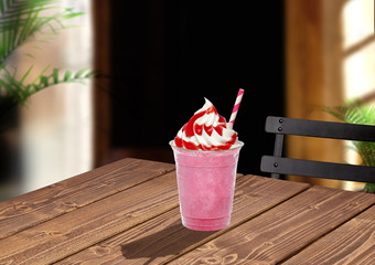 Whip strawberry frappuccino latte milkshake with cream, sorbet, syrup, sherbet on wooden cafe table
