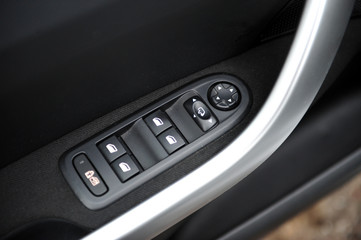 controls near the steering wheel in a modern car