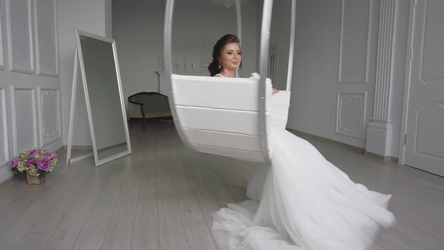 morning of the bride, a beautiful woman in a white dress is preparing for the wedding, slow motion