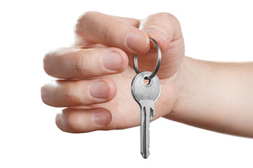 Hand holding a key, isolated on white background