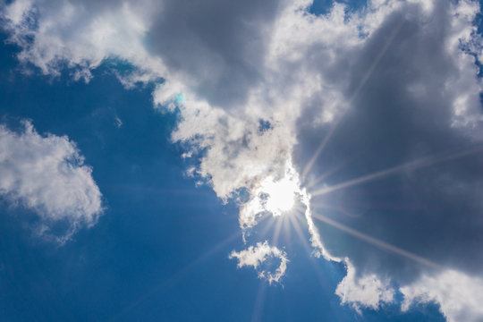 Sunshine in a blue cloudy sky