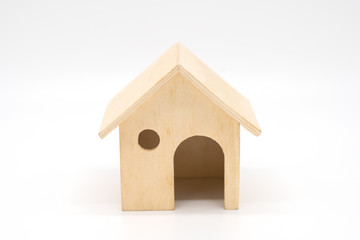 Toy wooden house on a white background