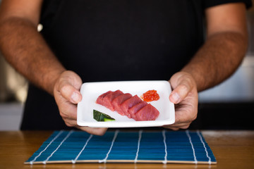 Crop vendor showing served tuna on plate