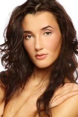 Portrait of young beautiful woman with curly hair and clear make-up