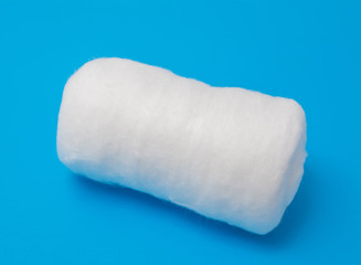 medical cotton or wool on a blue background abstract