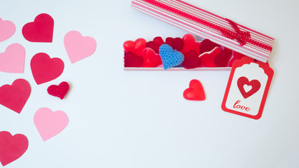 San Valentine´s day  decoration made withabox with heart jelly beans gummies and red and pink paper hearts. Lover gift.