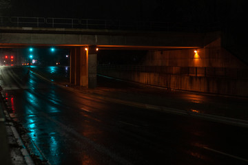 Toronto, CANADA - December 4th, 2019: Dramatic rainy night with empty streets and reflecting traffic lights in city suburbia roads