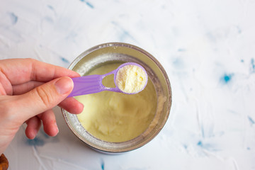 Baby milk formula and bottle on a white background. Food for children