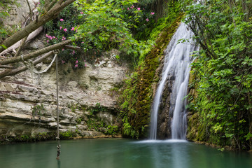 Waterfall in natural cave. Bath of Aphrodite. Cyprus.